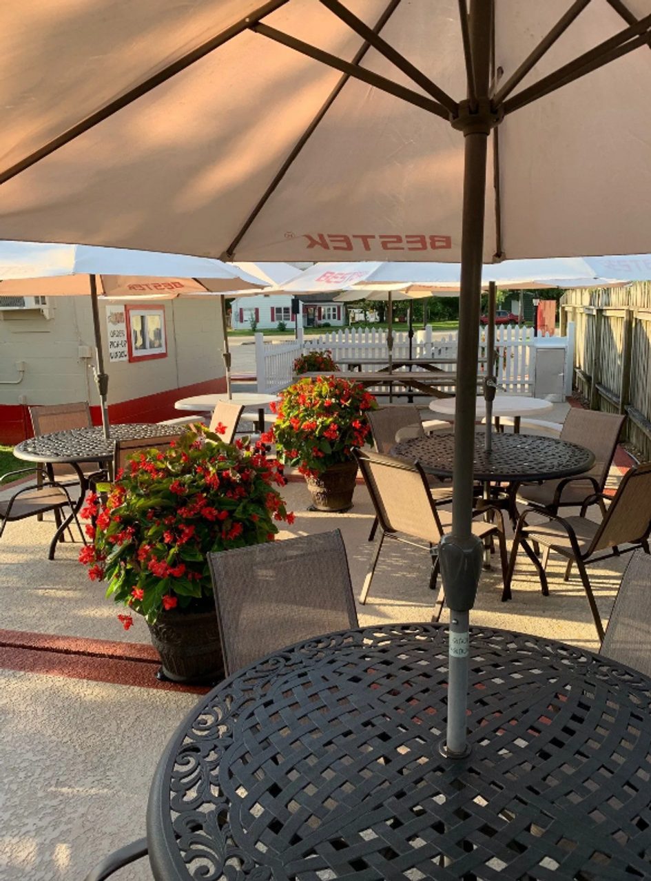 Cruiser's patio with tables, umbrellas and flower planters
